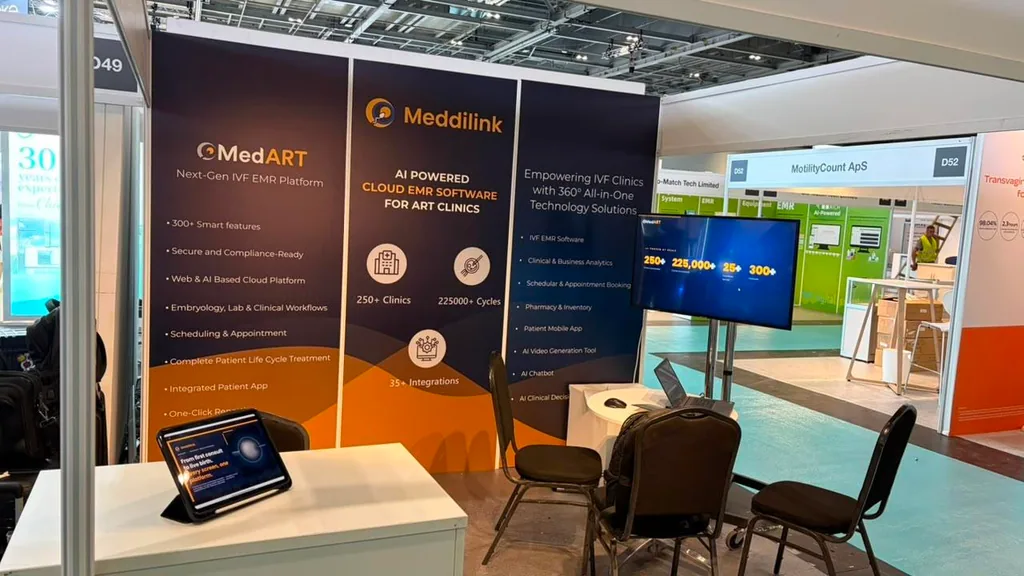 A candid moment at the Meddilink booth during a live MedART demonstration to a fertility clinic delegation at ESHRE 2026.